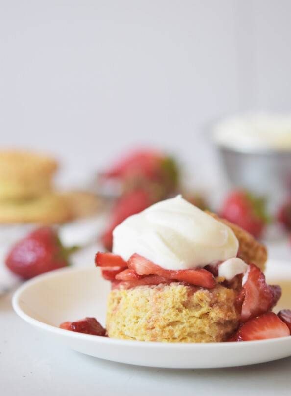 close up of strawberry shortcake on a biscuit