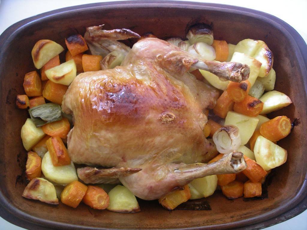 chicken dinner in a clay roaster