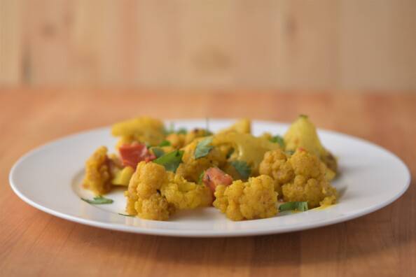 curried cauliflower on a white plate