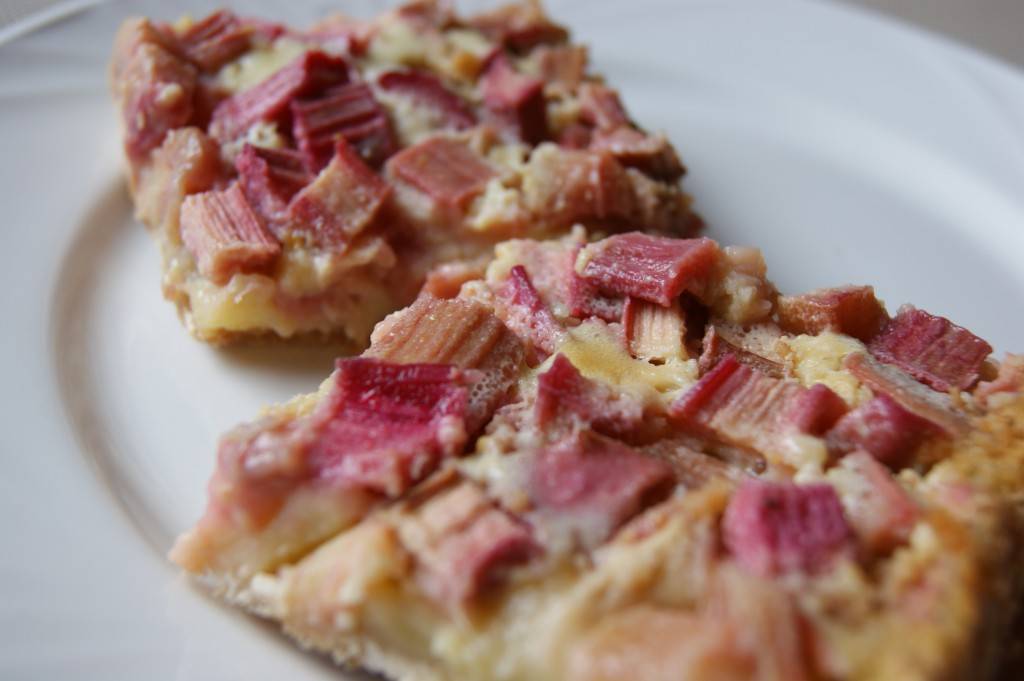 rhubarb custard bars on a white plate