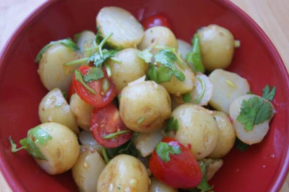 new potato salad with herbs, cherry tomatoes, and chipotle lime vinaigrette