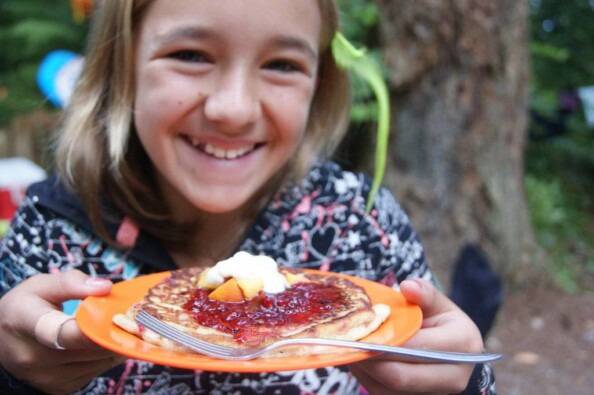 neice with a fully loaded huckleberry pancake