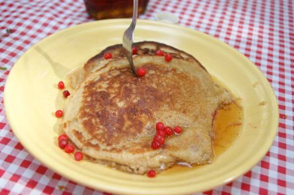 Huckleberries on top of pancakes