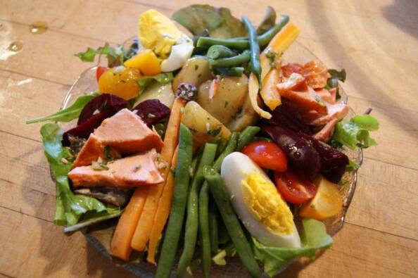 a composed salad of salmon, boiled egg, steamed vegetables