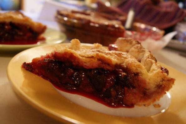 slice of apple plum blackberry pie