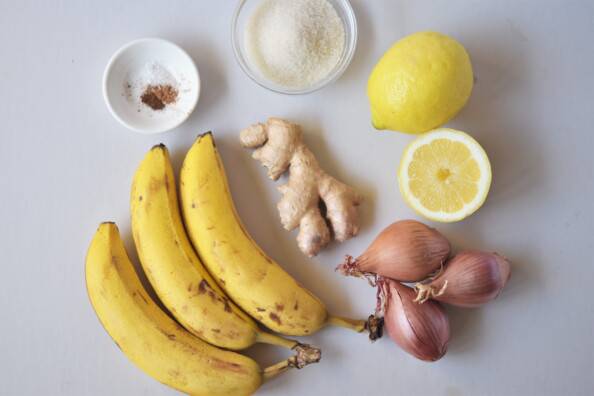 Ingredients for banana ginger chutney on a white background