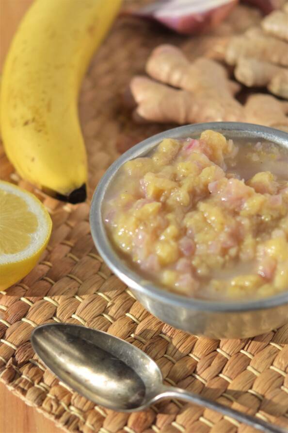 45 degree angle shot of banana chutney in a silver bowl