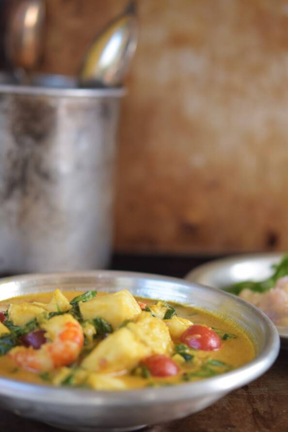 south Indian coconut seafood curry in a silver bowl