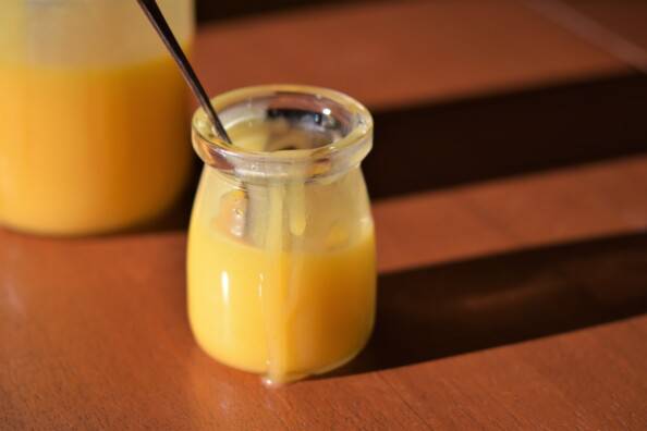 Two jars of lemon curd in the sun