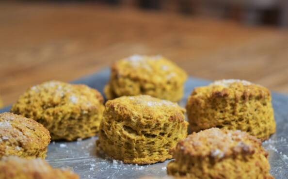 pumpkin spice scones on a silver baking tray