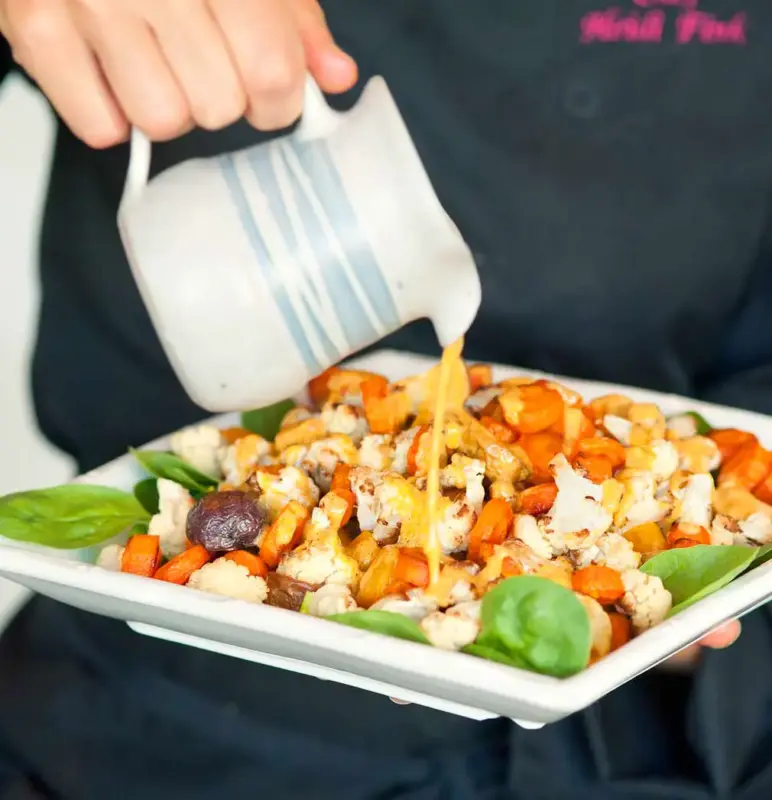 chef-heidi-pouring-sauce