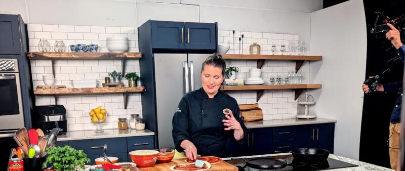 Chef Heidi Fink on set cooking